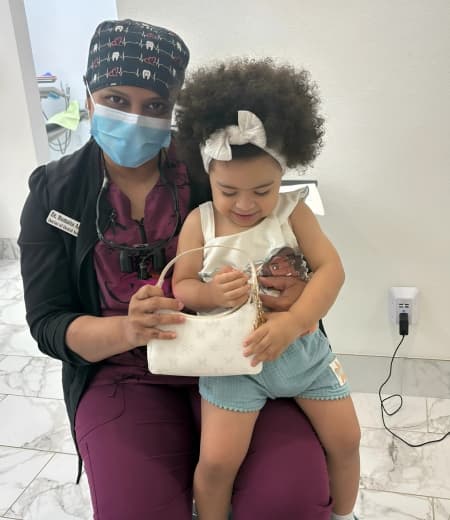 Teen boy in North Face hoodie with braces