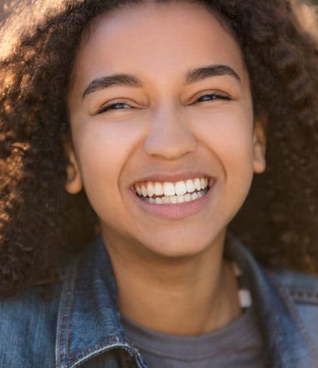 Adult woman smiling in dental office
