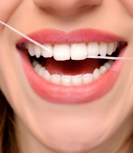 Adult woman smiling in dental office